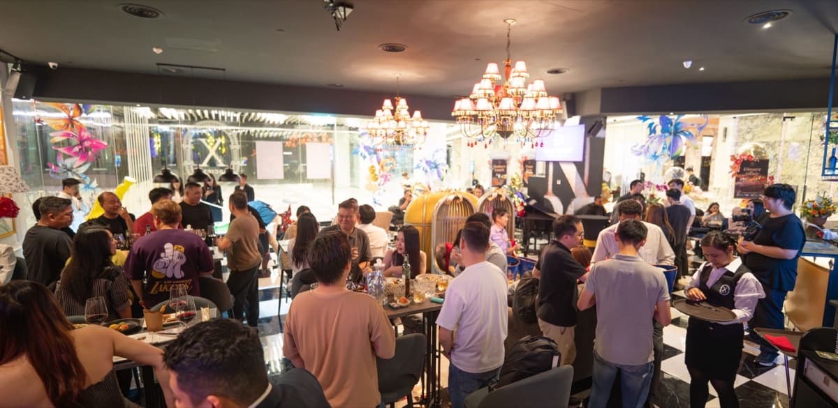 Guests mingling over drinks at X Society